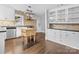 Spacious kitchen with white cabinets, granite countertops, a center island, and stainless steel appliances at 121 Ne 33Rd Ave, Hickory, NC 28601