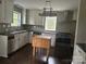 Well-appointed kitchen showcases white cabinetry, stainless steel appliances, and sleek dark countertops at 121 Ne 33Rd Ave, Hickory, NC 28601