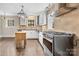 Bright kitchen featuring stainless steel appliances, granite countertops, and a stylish butcher block island at 121 Ne 33Rd Ave, Hickory, NC 28601