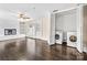 Bright living room with hardwood floors, a brick fireplace, and a laundry closet with washer and dryer at 121 Ne 33Rd Ave, Hickory, NC 28601