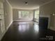 Charming living room featuring a fireplace, hardwood floors, and natural light from the many windows at 121 Ne 33Rd Ave, Hickory, NC 28601