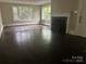Inviting living room boasts a fireplace, large windows, and hardwood floors, creating a comfortable space at 121 Ne 33Rd Ave, Hickory, NC 28601