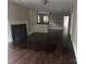 Spacious living room with fireplace, built-in cabinet, and rich hardwood floors provides a cozy atmosphere at 121 Ne 33Rd Ave, Hickory, NC 28601