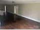 Bright living room featuring hardwood floors, white trim, and glass doors for an open and airy feel at 121 Ne 33Rd Ave, Hickory, NC 28601