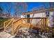 Inviting wooden deck and steps lead to the back of a house with white siding and a dark door at 1229 Jenkins St, Rock Hill, SC 29732