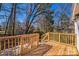 Newly refinished wooden deck overlooking a private and wooded backyard at 1229 Jenkins St, Rock Hill, SC 29732