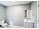 Bathroom with white vanity and toilet and light gray walls at 1229 Jenkins St, Rock Hill, SC 29732