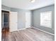 Bedroom with gray walls, wood-look floors, and white trim at 1229 Jenkins St, Rock Hill, SC 29732