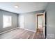 Bedroom with gray walls, wood-look floors, and a window at 1229 Jenkins St, Rock Hill, SC 29732