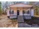 Inviting single-story home featuring a cozy front porch and classic architectural details at 1229 Jenkins St, Rock Hill, SC 29732