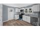 Bright kitchen featuring white cabinets, gray countertop and stainless steel appliances at 1229 Jenkins St, Rock Hill, SC 29732