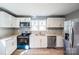 Updated kitchen with white cabinets, stainless steel appliances, and granite countertops at 1229 Jenkins St, Rock Hill, SC 29732