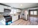 Modern kitchen with white cabinets, stainless steel appliances, and granite countertops at 1229 Jenkins St, Rock Hill, SC 29732