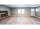 Bright living area featuring a brick fireplace, new floors, and a welcoming atmosphere at 1229 Jenkins St, Rock Hill, SC 29732