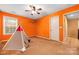 Bedroom featuring carpet, ceiling fan, teepee tent, airplane wall decor, and door to hallway at 128 Lacona Trce, Mooresville, NC 28115