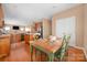 Charming dining area with a table, chairs, and natural light, adjacent to the kitchen at 128 Lacona Trce, Mooresville, NC 28115