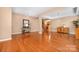 Spacious living room featuring hardwood floors, neutral paint, and an open layout perfect for entertaining guests or Gathering at 128 Lacona Trce, Mooresville, NC 28115
