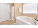 Relaxing bathroom with separate shower, soaking tub and neutral color palette at 128 Lacona Trce, Mooresville, NC 28115