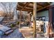 Inviting covered deck with bench seating, plants, and decorative accents at 152 Muskhogean Way, Mount Gilead, NC 27306