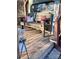 Cozy backyard deck with wood bench and colorful decor at 152 Muskhogean Way, Mount Gilead, NC 27306