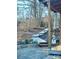 Cozy backyard with wooden walkway, rock gardens, and covered deck area at 152 Muskhogean Way, Mount Gilead, NC 27306