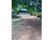 Exterior view highlighting backyard, storage shed, screened porch, and gravel driveway at 152 Muskhogean Way, Mount Gilead, NC 27306