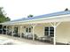 Community clubhouse featuring picnic tables, seating, and lake views at 152 Muskhogean Way, Mount Gilead, NC 27306