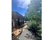 Exterior showcases covered porch, small storage shed, and view of waterway at 152 Muskhogean Way, Mount Gilead, NC 27306