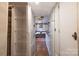 Hallway view features a pantry, refrigerator, and living room at 152 Muskhogean Way, Mount Gilead, NC 27306
