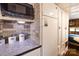 Compact kitchen features stone backsplash, modern appliances, and ample cabinet space at 152 Muskhogean Way, Mount Gilead, NC 27306