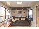 This home's cozy living room has a pull-out couch, natural light, and neutral colors at 152 Muskhogean Way, Mount Gilead, NC 27306