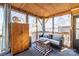 The screened porch has a wood ceiling, comfortable seating and outdoor views at 152 Muskhogean Way, Mount Gilead, NC 27306