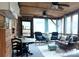 The screened porch has wood ceiling, ceiling fans, ample seating, and views of the outdoors at 152 Muskhogean Way, Mount Gilead, NC 27306