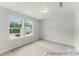 Bedroom with neutral carpet, natural light, and a view of the neighborhood at 156 Tangle River Dr # 35, Statesville, NC 28677