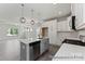 Kitchen features an island, stainless steel dishwasher, range and an open layout at 156 Tangle River Dr # 35, Statesville, NC 28677