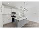 Kitchen with stainless steel appliances, a kitchen island, and modern pendant lighting at 156 Tangle River Dr # 35, Statesville, NC 28677