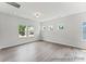 Living room featuring lots of natural light, with hardwood floors, and neutral wall paint at 156 Tangle River Dr # 35, Statesville, NC 28677