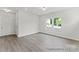 Living room featuring hardwood floors, neutral paint, and a double door closet at 156 Tangle River Dr # 35, Statesville, NC 28677