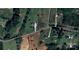 Aerial view of property showcasing the home's positioning in a landscape with a wooded area at 1638 Bess Town Rd, Bessemer City, NC 28016