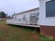 View of back deck with white railings overlooking the yard at 1638 Bess Town Rd, Bessemer City, NC 28016