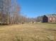 Large backyard with trees on the side property line at 1638 Bess Town Rd, Bessemer City, NC 28016