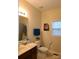 Bathroom featuring single vanity with a warm, neutral color palette and natural light at 1638 Bess Town Rd, Bessemer City, NC 28016