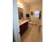 Cozy bathroom featuring a single vanity with a warm, neutral color palette and tile flooring at 1638 Bess Town Rd, Bessemer City, NC 28016
