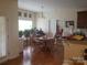 The dining room features natural light, wood floors, and a view to the kitchen area at 1638 Bess Town Rd, Bessemer City, NC 28016
