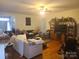 Open living room with hardwood floors and a ceiling fan at 1638 Bess Town Rd, Bessemer City, NC 28016