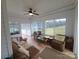 Bright sun room with wood flooring, white ceiling and view of the backyard at 1638 Bess Town Rd, Bessemer City, NC 28016