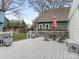 Spacious backyard deck featuring patio furniture with an outdoor umbrella and views of the backyard at 1921 Union St, Charlotte, NC 28205