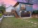 Modern two-story home featuring a garage, backyard patio, and string lights at 1921 Union St, Charlotte, NC 28205