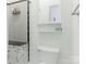 Bright bathroom featuring a toilet, a shower with gray tiles and a toiletry dispenser at 1921 Union St, Charlotte, NC 28205
