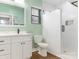 Modern bathroom with walk-in shower, sleek white vanity, and clean design at 1921 Union St, Charlotte, NC 28205